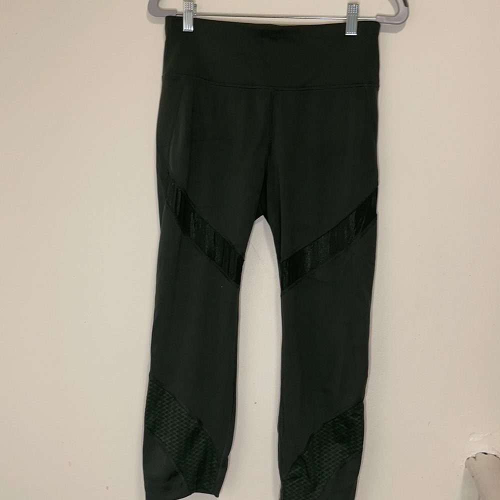 Army green leggings with mesh.